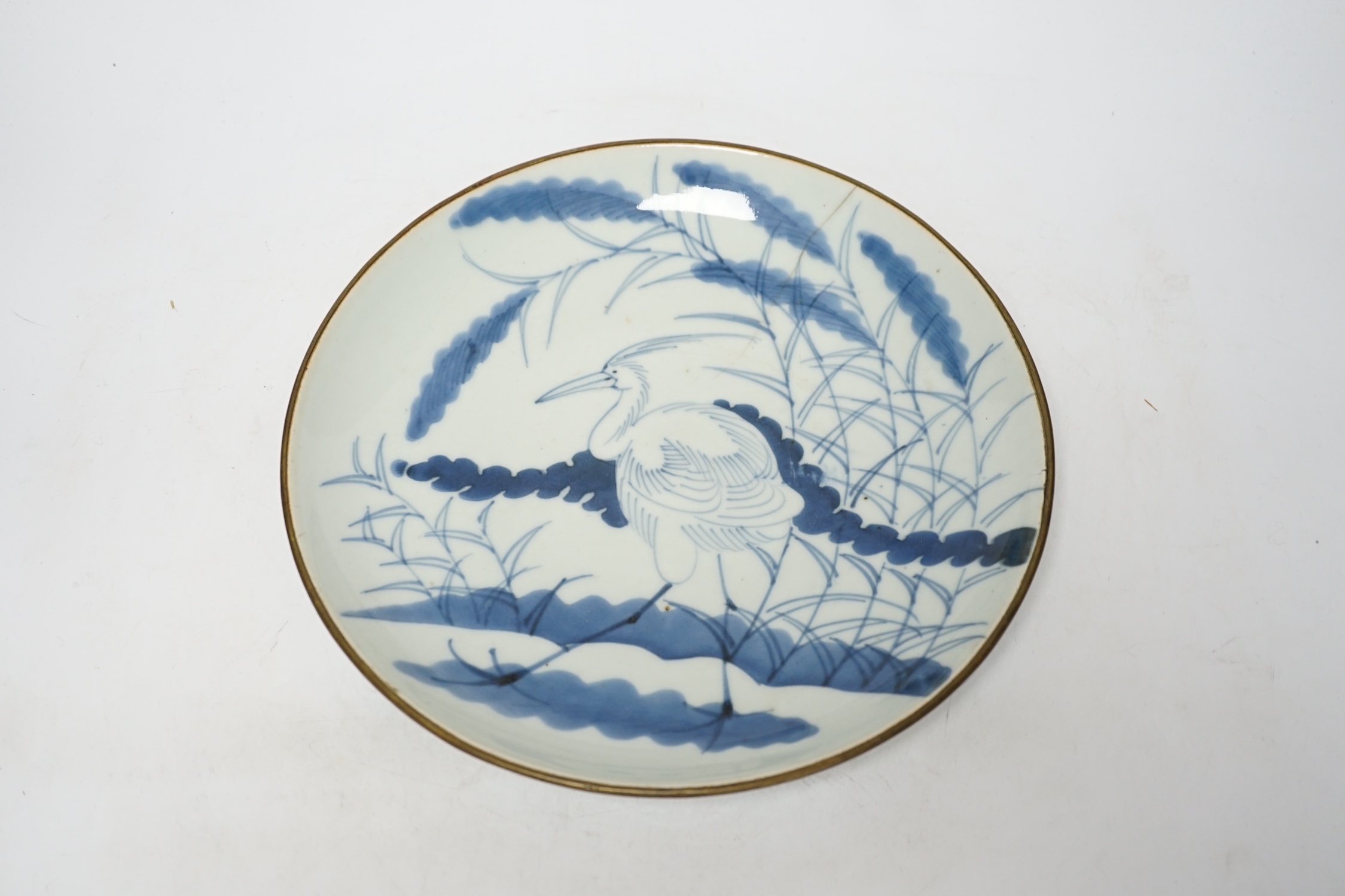 A Japanese Arita blue and white 'egret or heron' dish, 18th century, 28cm